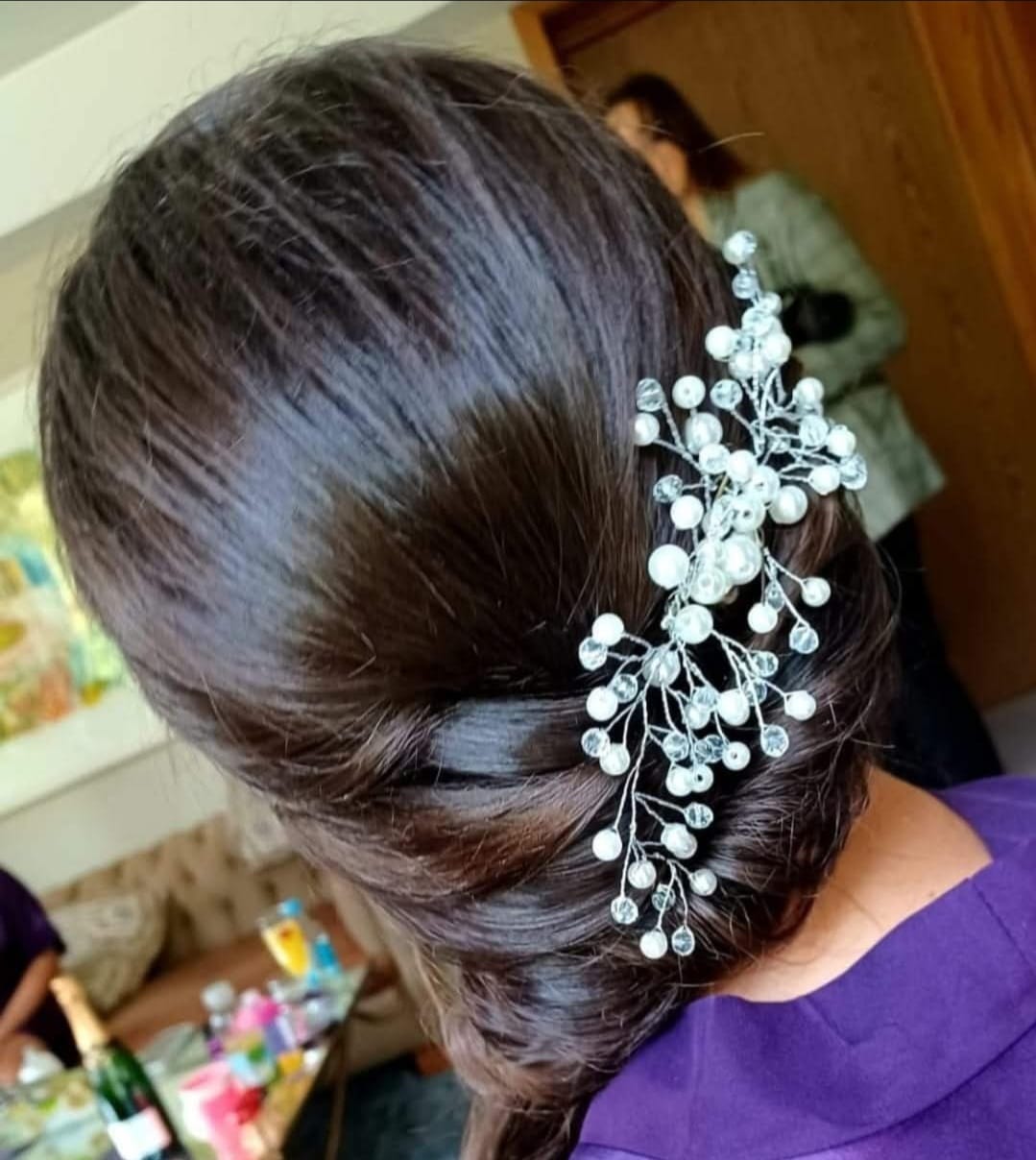 Elegant Pearl Updo - Professional hair styling in Barnsley Elegant Pearl Updo - Sophisticated updo with cascading pearl accessories at Stella's Hair & Beauty Salon Barnsley
