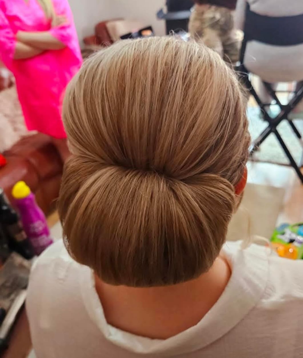Classic Chignon - Professional hair styling in Barnsley Classic Chignon - Timeless chignon perfect for formal occasions at Stella's Hair & Beauty Salon Barnsley