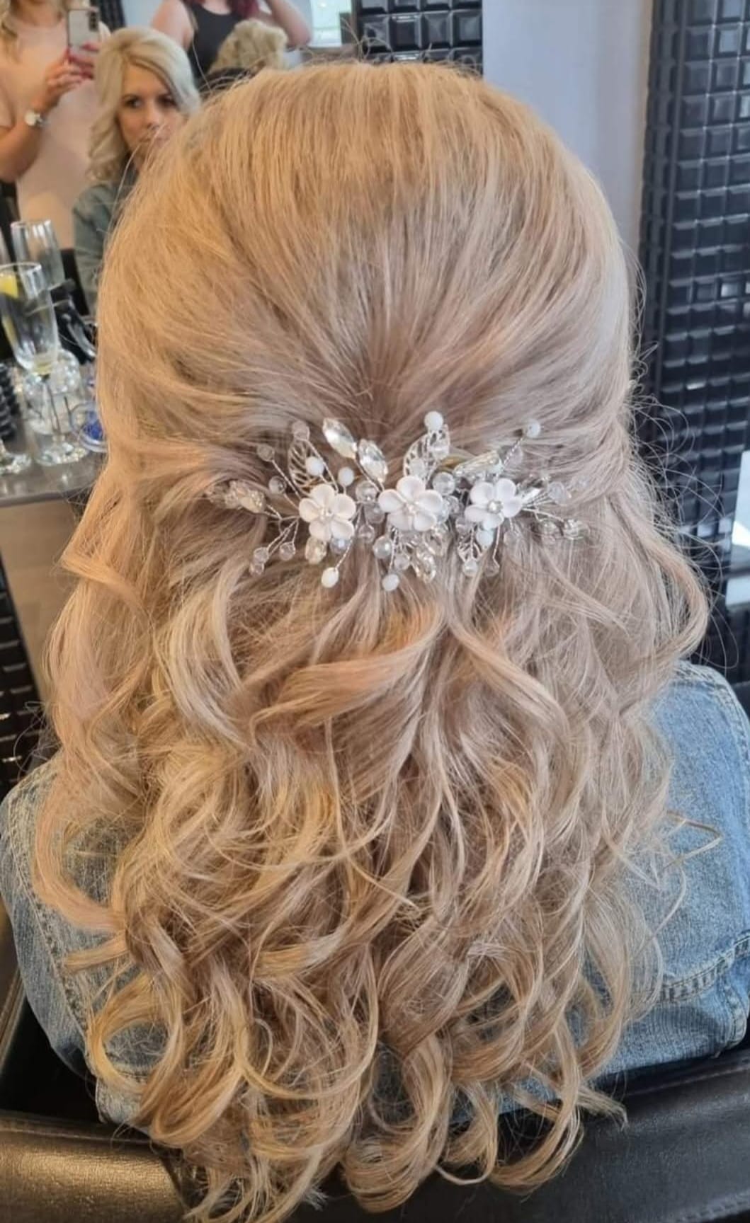Floral Hair Accessory - Professional hair styling in Barnsley Floral Hair Accessory - Half-up style with delicate floral accent at Stella's Hair & Beauty Salon Barnsley