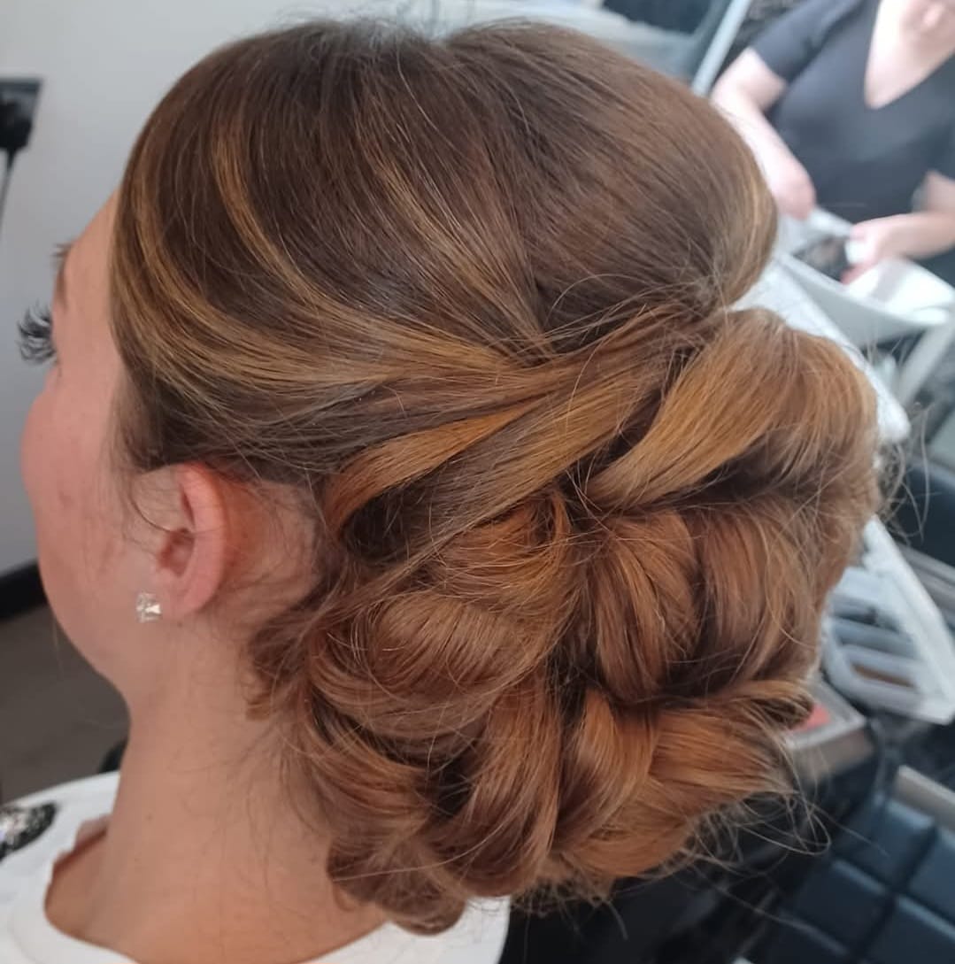 Side-Swept Updo - Professional hair styling in Barnsley Side-Swept Updo - Elegant side-swept formal updo at Stella's Hair & Beauty Salon Barnsley